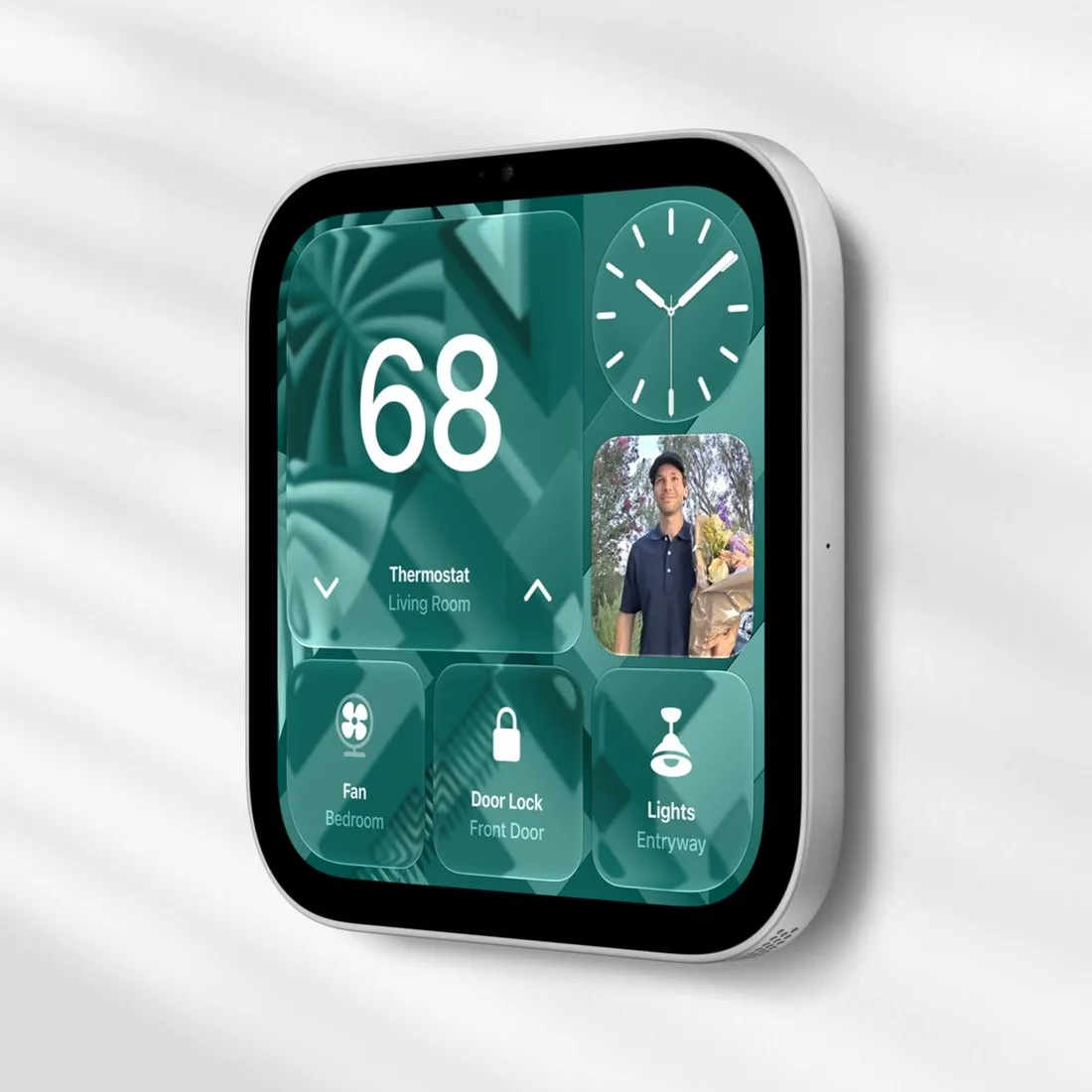Duvara monte edilmiş Apple HomeView, ekranda termostat, kamera ve ışık kontrolleri