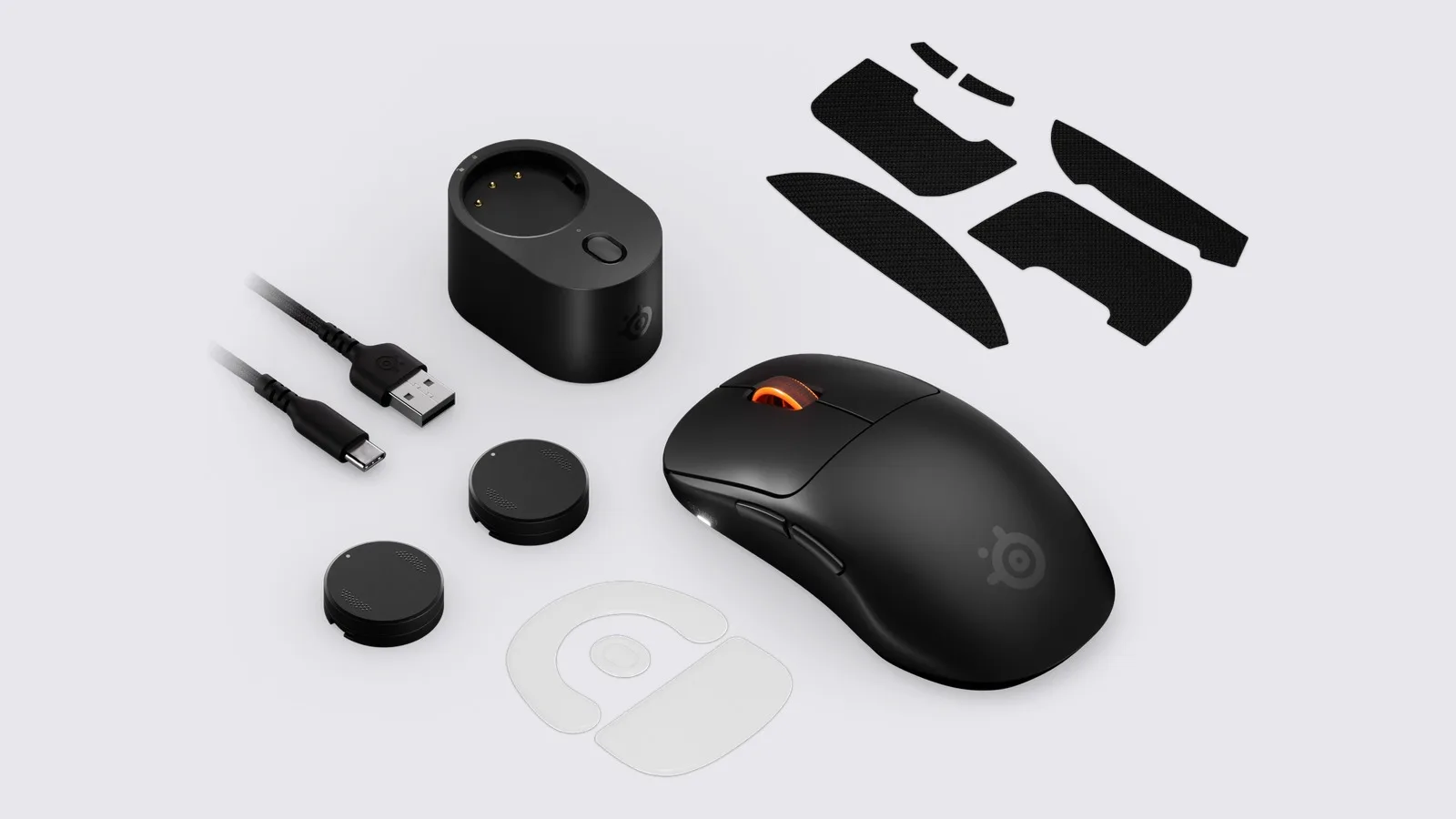SteelSeries Sensei Pro, kablosuz alıcı istasyonu, iki değiştirilebilir batarya, kaydırmaz yan bantlar ve USB kablosunun resmî ürün görseli