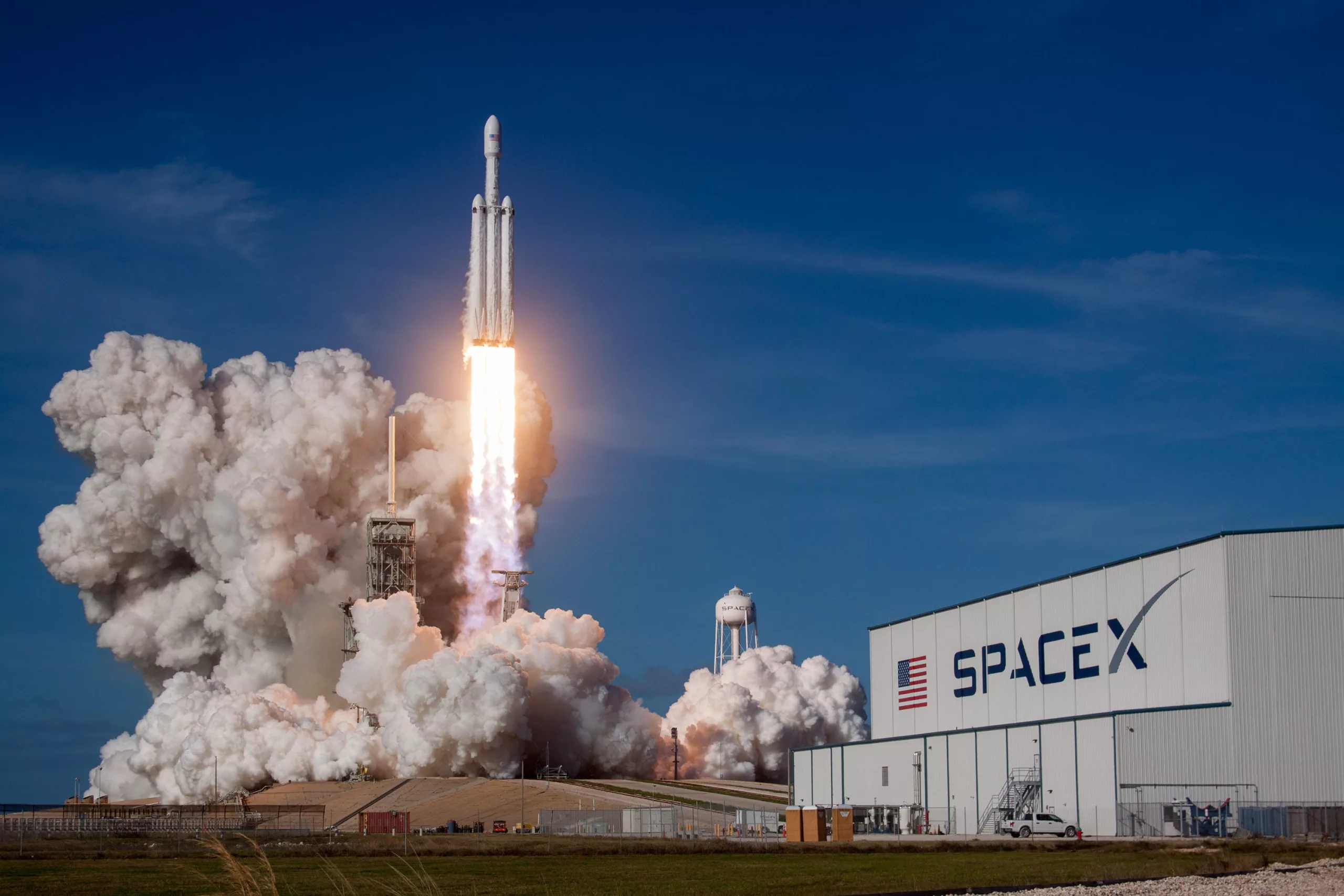 A stunning digital artwork of SpaceX Starship Flight 9 set against a colorful sunset sky, capturing the excitement of space exploration.