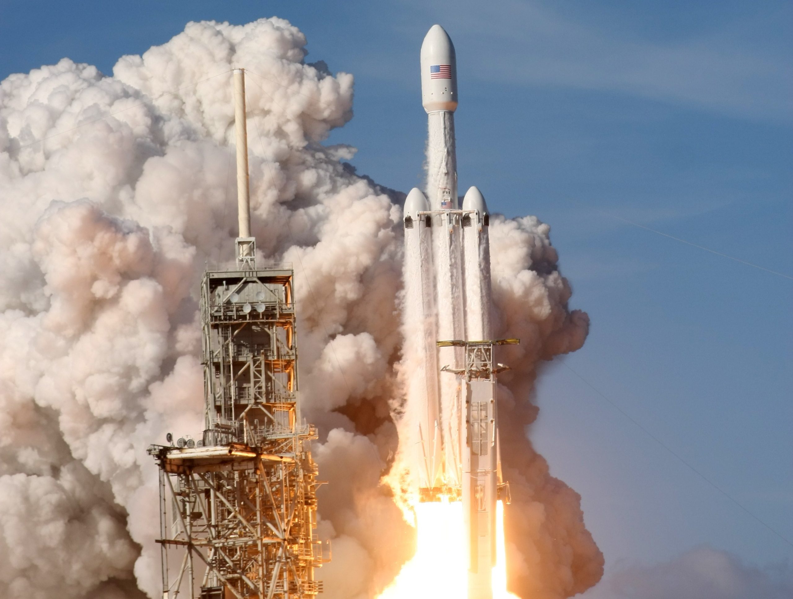 A digital artwork of SpaceX's Starship Flight 7 on the launch pad, showcasing a futuristic rocket ready for takeoff with engineers in the foreground.