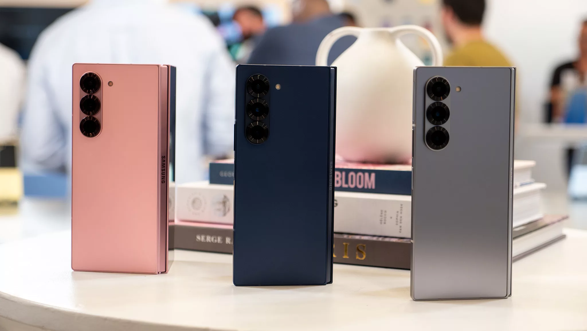 A modern graphic design featuring Samsung Galaxy Z Fold7, highlighting its foldable technology in a sleek and aesthetic layout.