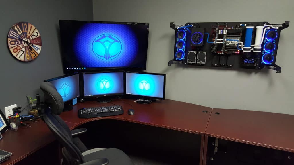 A modern wall-mounted PC setup in a minimalist workspace, maximizing desk space with stylish decor and ambient lighting.