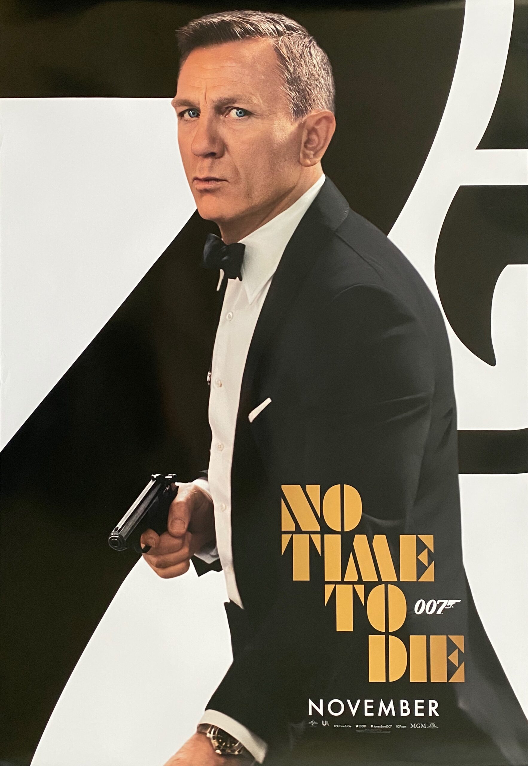 A sleek and modern poster design for a new James Bond film showcasing high-tech elements and intrigue.