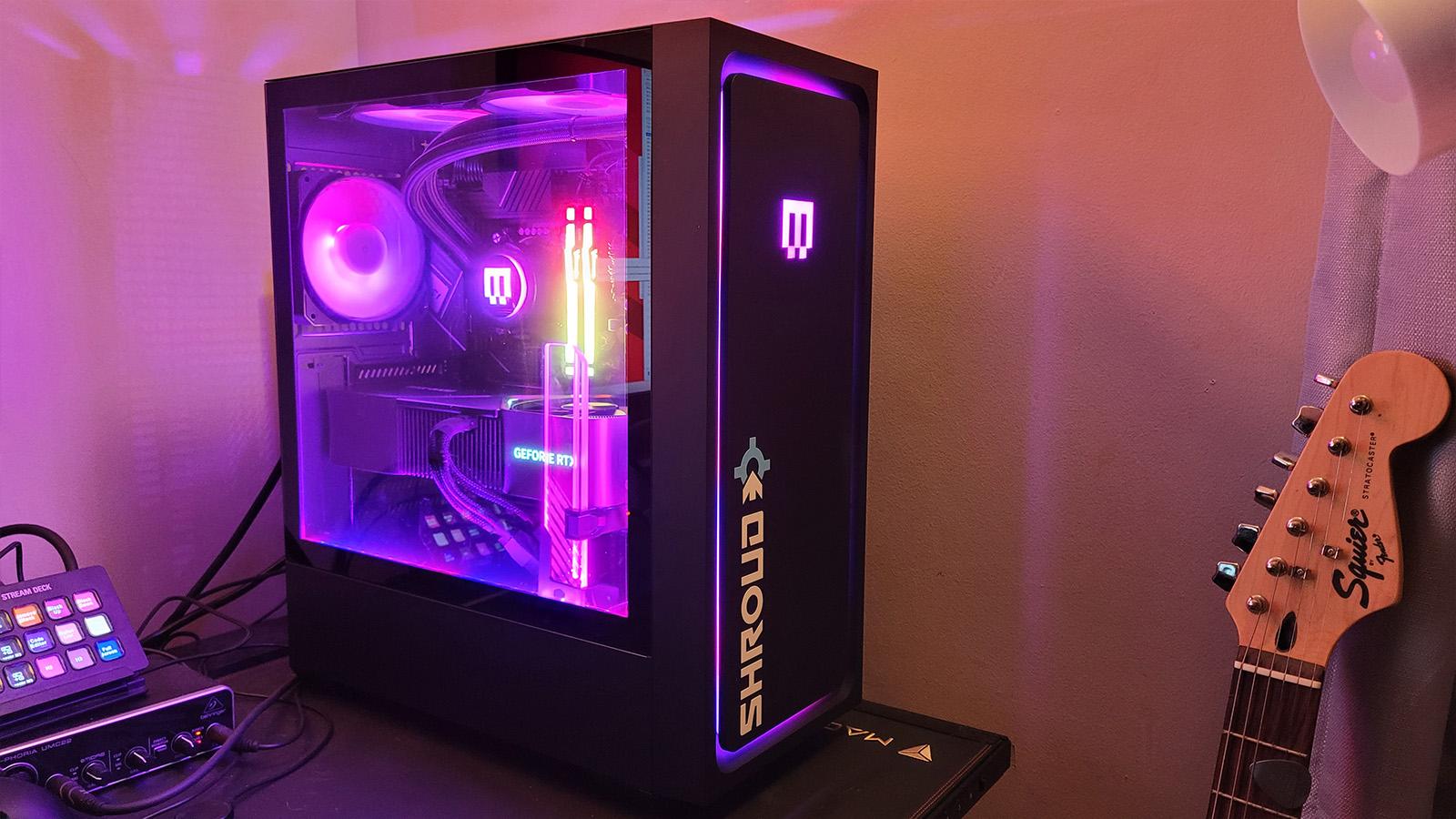 High-end gaming setup featuring Maingear MG-1 system and RTX 5060 graphics card.