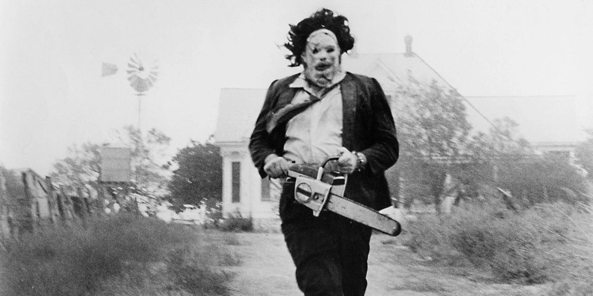 A modern artistic depiction inspired by The Texas Chainsaw Massacre featuring a stylized chainsaw in an eerie landscape.