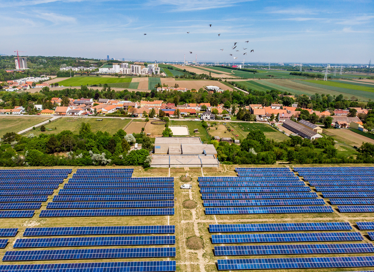 An illustration of Vienna's energy transition showcasing geothermal systems and sustainable heating solutions in a modern urban landscape.