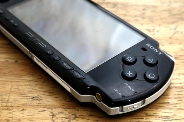 Futuristic PS6 handheld gaming console showcasing sleek design and compatibility with PS5 games.
