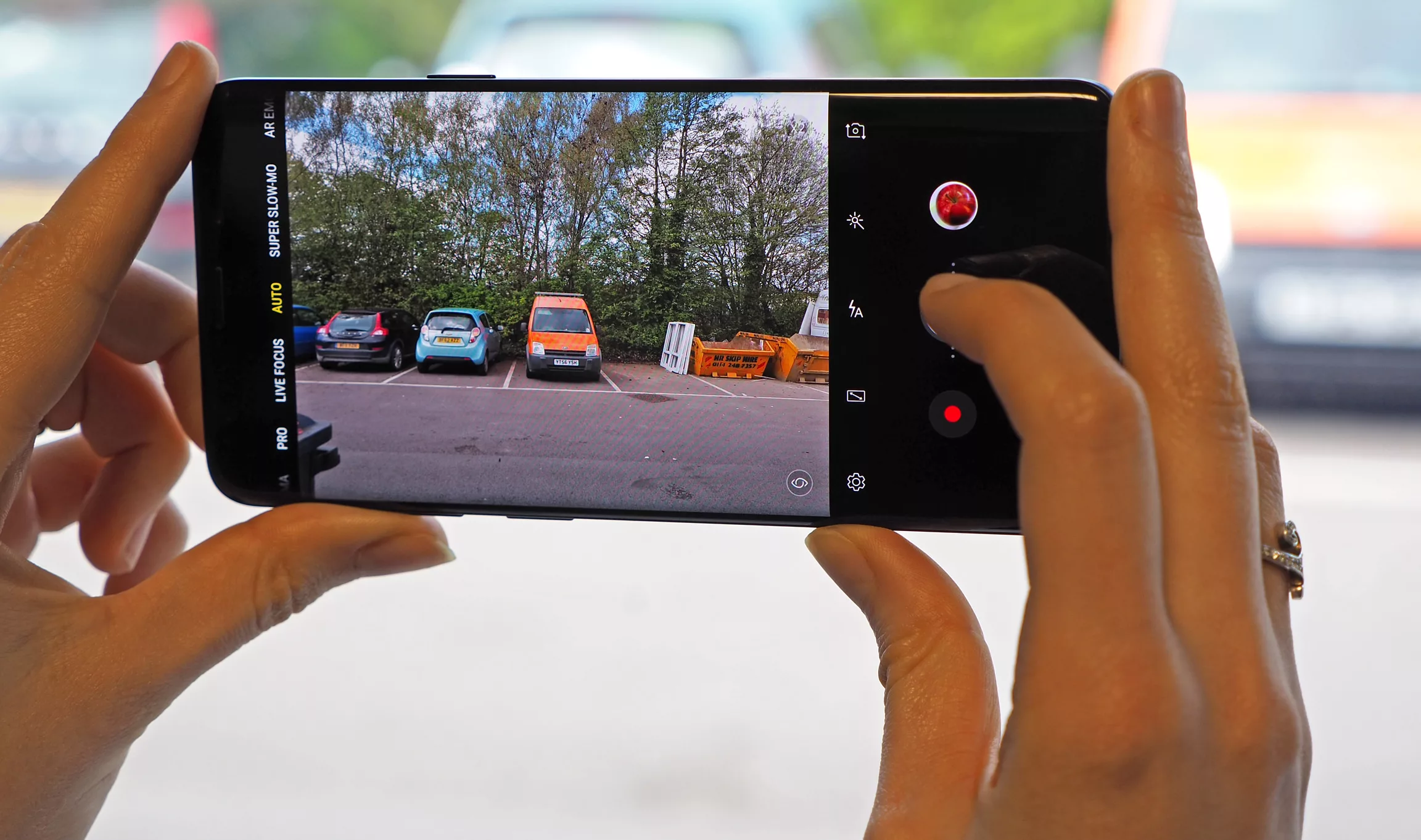 A modern smartphone on a stylish desk symbolizing how to save money with its camera features.