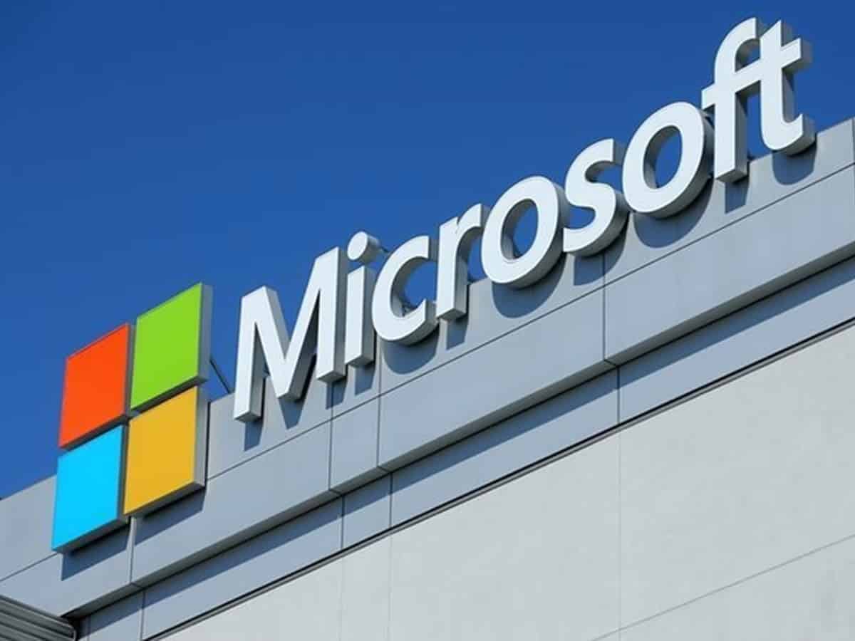 Illustration depicting the Microsoft employee layoff protest, with diverse people holding signs amidst a futuristic digital landscape.