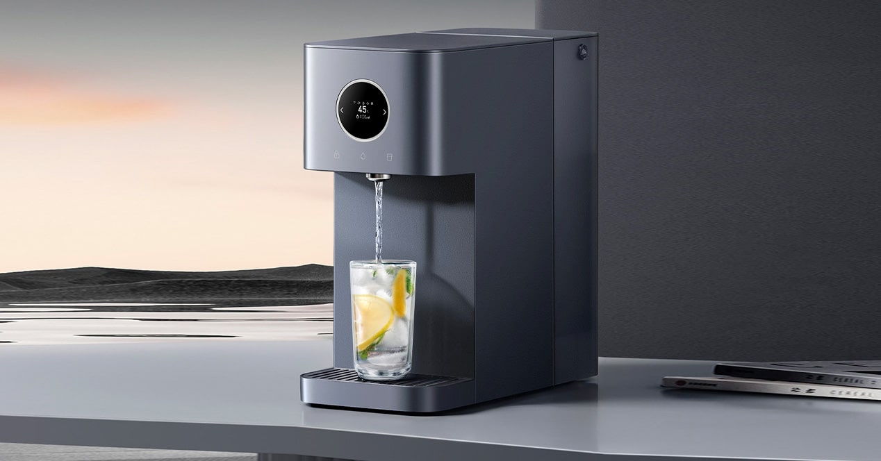 A modern Xiaomi Mijia Mineral-Rich Water Purifier on a clean kitchen countertop with natural lighting and greenery.