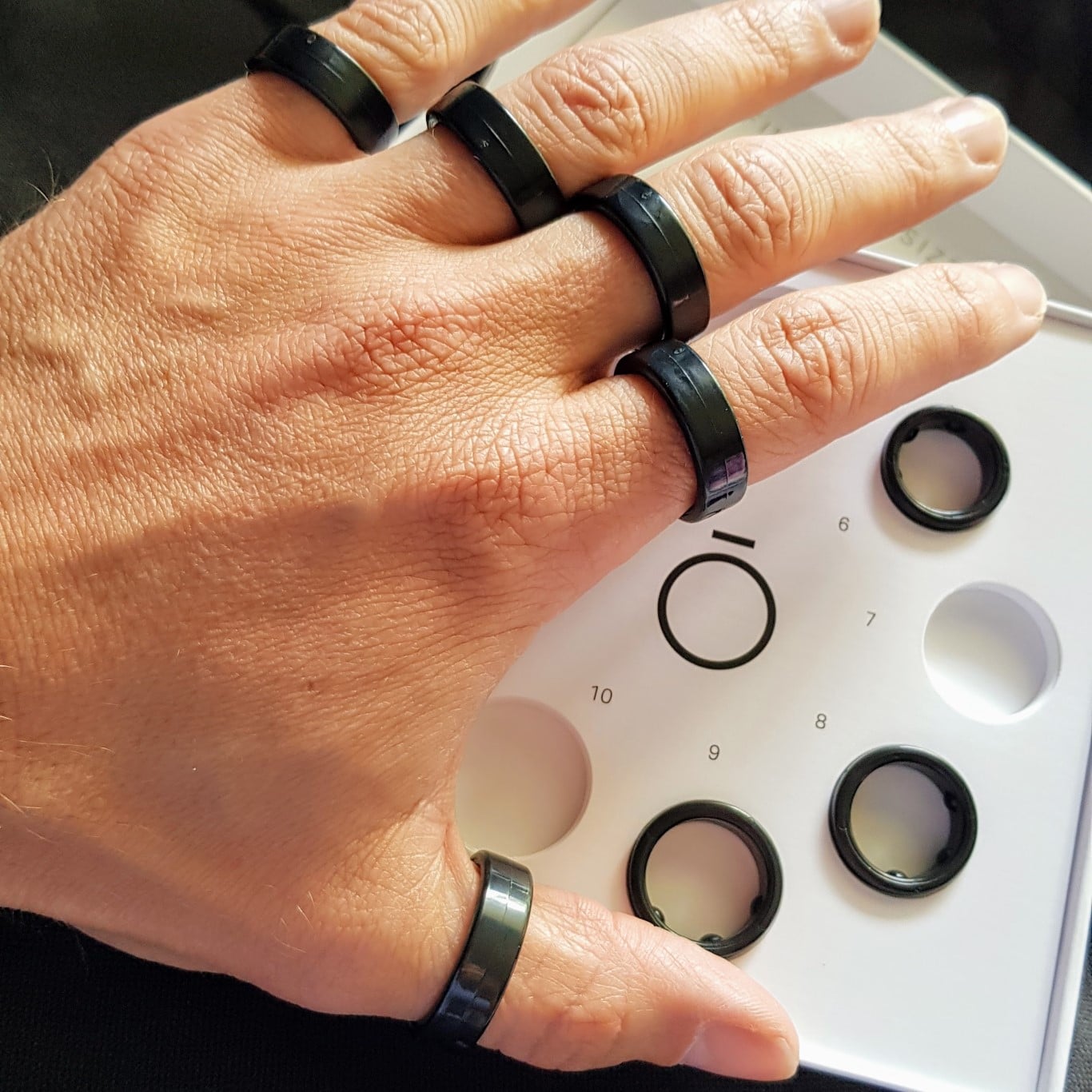 High-quality visual representation of Oura wearable technology showcasing the Oura ring with abstract digital elements.