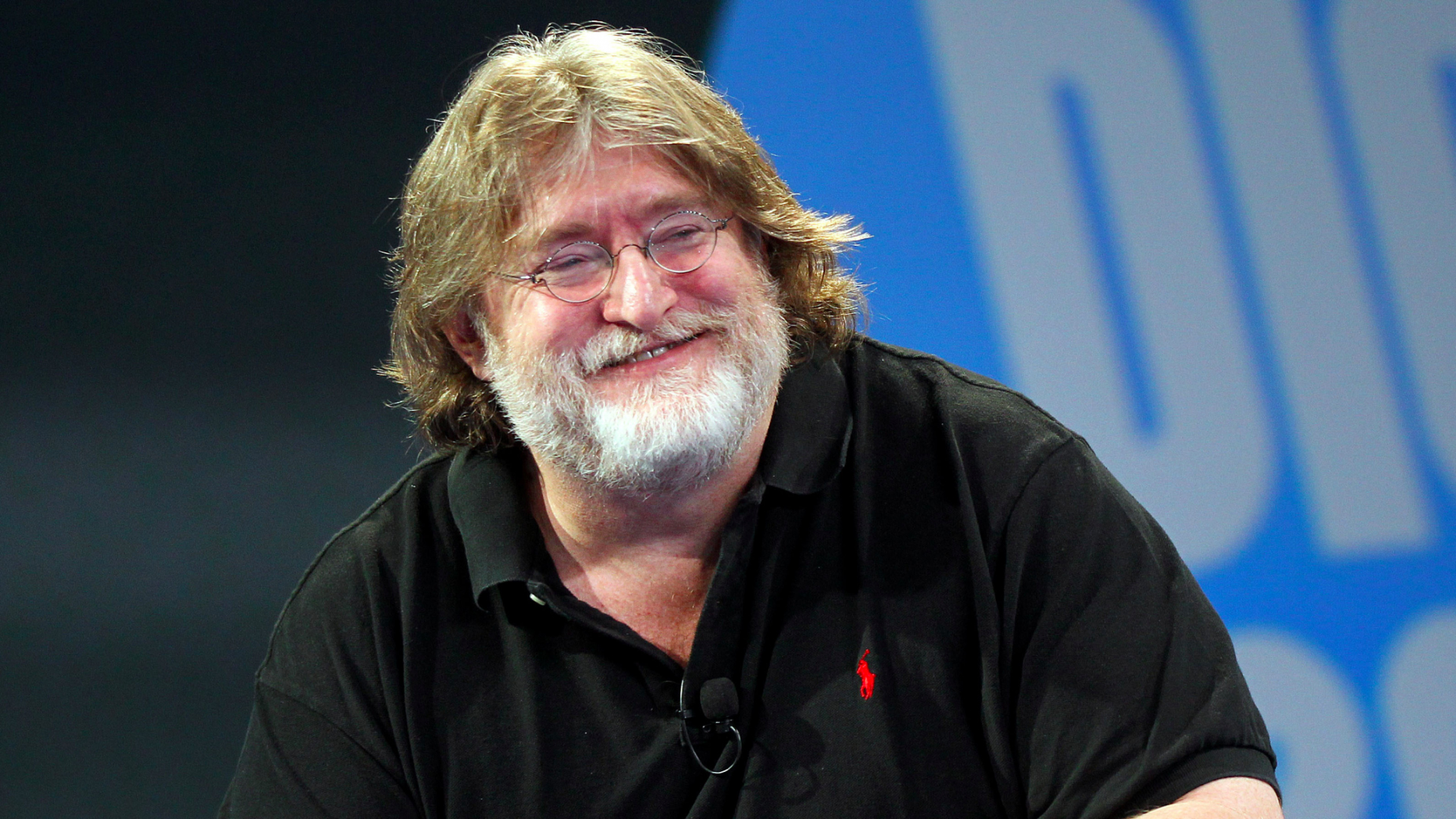 Gabe Newell immersed in the eerie world of STALKER 2 with a high-tech gaming setup.